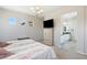Spacious bedroom featuring carpet, recessed lights, a TV, and an ensuite bathroom at 4317 Velvet Ridge Ct, Las Vegas, NV 89129