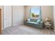 Cozy bedroom with a comfortable couch, soft carpet, and a bright window at 4317 Velvet Ridge Ct, Las Vegas, NV 89129