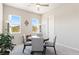 Charming dining area with carpeted floors, a glass table, and plenty of natural light at 4317 Velvet Ridge Ct, Las Vegas, NV 89129