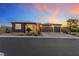 Charming single-story home with desert landscaping and a two-car garage at sunset at 4317 Velvet Ridge Ct, Las Vegas, NV 89129