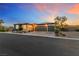 Beautiful single-story home with desert landscaping and a two-car garage at sunset at 4317 Velvet Ridge Ct, Las Vegas, NV 89129