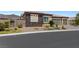 Attractive single-story home with rock landscaping and a two-car garage on a sunny day at 4317 Velvet Ridge Ct, Las Vegas, NV 89129
