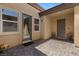 Welcoming front porch with decorative potted plants, paving stones, and a glass-paneled front door at 4317 Velvet Ridge Ct, Las Vegas, NV 89129