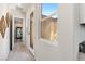 Hallway with access to outside, china cabinet, and carpeted floors at 4317 Velvet Ridge Ct, Las Vegas, NV 89129