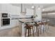 Spacious kitchen boasts stainless steel appliances, marble countertops, a large island with seating, and ample storage at 4317 Velvet Ridge Ct, Las Vegas, NV 89129