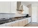 Stylish kitchen with white cabinets, granite countertops, stainless steel appliances, and ample storage space at 4317 Velvet Ridge Ct, Las Vegas, NV 89129