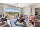 Cozy living area with large sliding glass doors offering scenic views of landscaped backyard and garden at 4317 Velvet Ridge Ct, Las Vegas, NV 89129