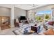 Comfortable living room with ceiling fan, rug, patio access, and lots of natural light at 4317 Velvet Ridge Ct, Las Vegas, NV 89129