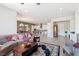 Open-concept living space with natural light and access to modern kitchen and dining area at 4317 Velvet Ridge Ct, Las Vegas, NV 89129