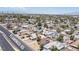 An aerial view shows the neighborhood surrounding the property with lush landscaping at 4516 E Flamingo Rd, Las Vegas, NV 89121