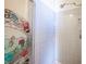Shower featuring blue tile walls and a vintage shower door at 4516 E Flamingo Rd, Las Vegas, NV 89121
