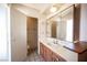 Bathroom with tiled floor, vanity, and a mirrored medicine cabinet at 4516 E Flamingo Rd, Las Vegas, NV 89121