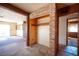 Open closet space with built-in shelving, brick surround, and access to living areas at 4516 E Flamingo Rd, Las Vegas, NV 89121
