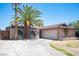 View of a single story brick home with a 2 car garage at 4516 E Flamingo Rd, Las Vegas, NV 89121