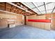 Spacious garage with overhead lighting, open ceiling, and storage cabinets along the back wall at 4516 E Flamingo Rd, Las Vegas, NV 89121