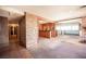 Spacious living room with a brick accent wall and a bar at 4516 E Flamingo Rd, Las Vegas, NV 89121