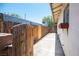 Side yard featuring a gate, fence, and exterior storage at 4516 E Flamingo Rd, Las Vegas, NV 89121
