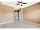 Neutral bedroom featuring tile floors, ceiling fan and access to a bathroom at 4730 E Craig Rd # 1005, Las Vegas, NV 89115