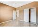 Neutral bedroom featuring tile floors, sliding door closet, and convenient access to the kitchen at 4730 E Craig Rd # 1005, Las Vegas, NV 89115