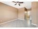 Neutral bedroom featuring tile floors, ceiling fan and access to an adjoining bathroom at 4730 E Craig Rd # 1005, Las Vegas, NV 89115