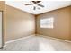Neutral bedroom featuring tile floors, ceiling fan and a bright window view at 4730 E Craig Rd # 1005, Las Vegas, NV 89115