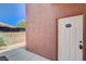 Apartment entrance featuring a white door with black numbering and adjacent wall at 4730 E Craig Rd # 1005, Las Vegas, NV 89115