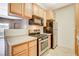 Kitchen showcasing the stainless gas range oven and overhead microwave at 4730 E Craig Rd # 1005, Las Vegas, NV 89115