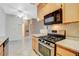 This well-lit kitchen features a gas range and stainless appliances at 4730 E Craig Rd # 1005, Las Vegas, NV 89115