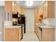 Well-lit kitchen with stainless appliances and wood cabinets at 4730 E Craig Rd # 1005, Las Vegas, NV 89115