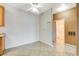 Bright kitchen area featuring tile flooring and white walls with ceiling fan at 4730 E Craig Rd # 1005, Las Vegas, NV 89115