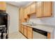 Kitchen includes a stainless dishwasher, double sink, and gas range at 4730 E Craig Rd # 1005, Las Vegas, NV 89115