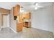 An eat-in kitchen features light wood cabinets and updated appliances at 4730 E Craig Rd # 1005, Las Vegas, NV 89115