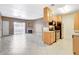 Living room with fireplace leads to the adjacent kitchen with stainless appliances at 4730 E Craig Rd # 1005, Las Vegas, NV 89115