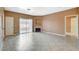 Bright living room with tiled floors, fireplace, and sliding glass door to balcony at 4730 E Craig Rd # 1005, Las Vegas, NV 89115