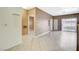 Open concept living room features neutral tones, tile floors and ample natural light at 4730 E Craig Rd # 1005, Las Vegas, NV 89115