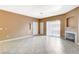 Spacious living room featuring tiled floors, a fireplace, and neutral paint tones at 4730 E Craig Rd # 1005, Las Vegas, NV 89115