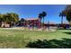 Vibrant community playground with colorful play structures and lush green surroundings on a sunny day at 4730 E Craig Rd # 1005, Las Vegas, NV 89115