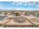 This aerial view captures a fully fenced-in yard and home with ample space to add a pool at 4801 Stoneham, Pahrump, NV 89061