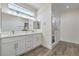 Bright bathroom featuring double vanity, white cabinets, and a luxurious walk-in shower at 4801 Stoneham, Pahrump, NV 89061
