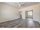 Spacious bedroom featuring new laminate flooring and a closet with sliding mirrored doors at 4801 Stoneham, Pahrump, NV 89061