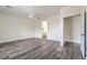 Spacious bedroom features gray wood floors, ensuite bathroom access, and a walk-in closet at 4801 Stoneham, Pahrump, NV 89061