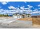 Inviting single-story home with a three-car garage, desert landscaping, and a welcoming entrance at 4801 Stoneham, Pahrump, NV 89061