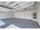 Spacious three-car garage featuring sealed concrete floors and ample lighting at 4801 Stoneham, Pahrump, NV 89061