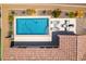 Aerial view of a backyard featuring a pool, patio and desert landscaping at 489 Intonation St, Henderson, NV 89011