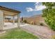 Backyard oasis with a covered patio, swimming pool, seating, and manicured lawn at 489 Intonation St, Henderson, NV 89011