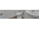 Bathroom features a pedestal sink and toilet on vinyl flooring at 489 Intonation St, Henderson, NV 89011