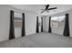 Bedroom with plush carpeting, ceiling fan, and views of the neighborhood at 489 Intonation St, Henderson, NV 89011