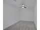 Bedroom with plush carpeting, neutral walls, and an installed ceiling fan at 489 Intonation St, Henderson, NV 89011