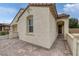 Beautiful stucco home features an arched entryway and brick paved driveway at 489 Intonation St, Henderson, NV 89011