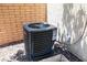 Exterior view of the Sierra brand air conditioner unit and hook ups at 489 Intonation St, Henderson, NV 89011